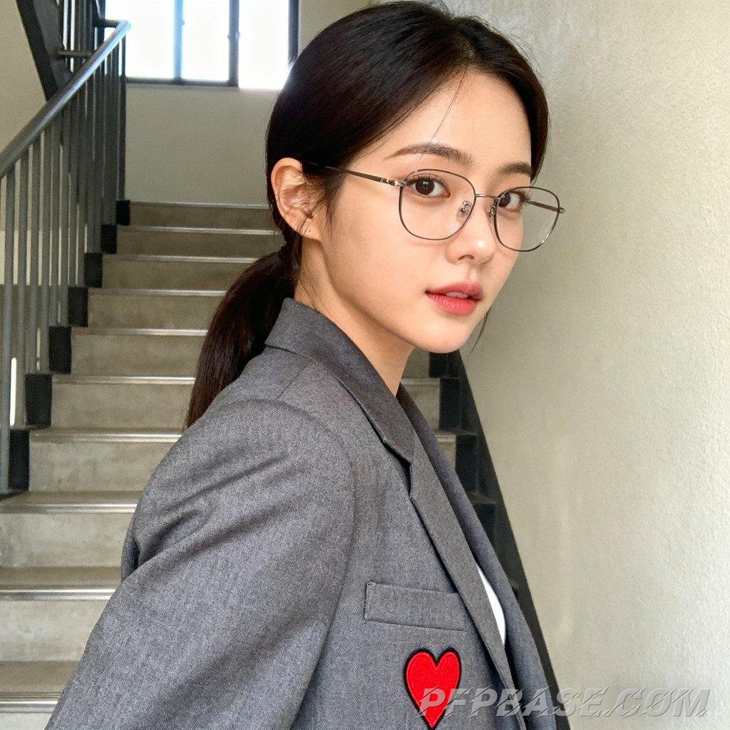 Image 1: white woman, side profile close-up, girl with cartoon hat, face covered by sweater, green plant back
